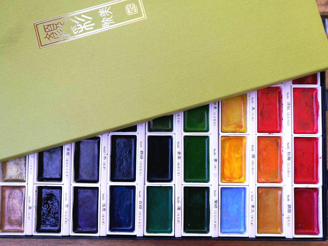 Przybory artysty pędzle farby kuretake kredki akwarelowe cienkopisy micron